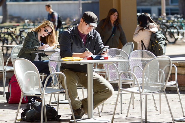 Students Studying at Outdoor Cafe