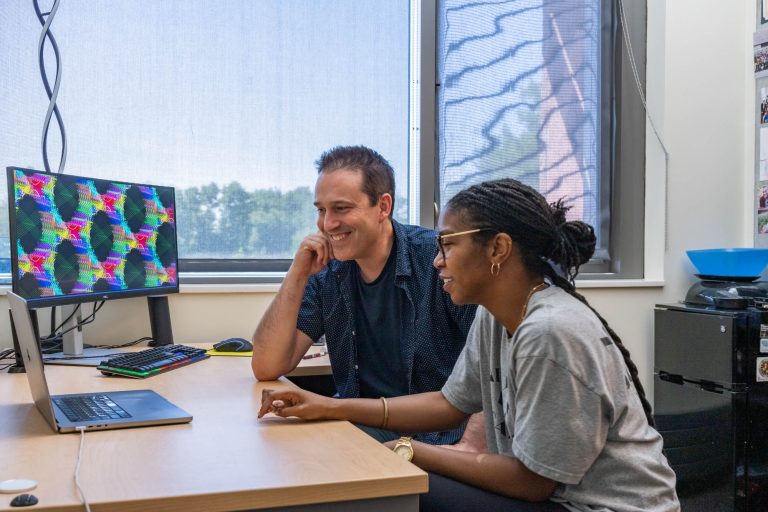 CSU chemical and biological engineering Professor Chris Snow works with Kimberly Robins, Ph.D. student in Microbiology Immunology and Pathology, on a protein design, August 28, 2024.