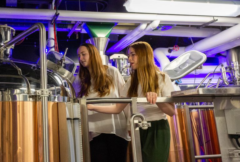 CSU engineering students Kyle Curtis (CBE), Kaylee McCarthy-Zayach (CBE), Mackenzie Lucas (CBE), Ethan Ahuna (CBE), and Isaac Reaves (ECE) work with Jeffrey Callaway, Director of the Fermentation Science and Technology Program at Colorado State University, in the Lory Student Center's Ramskeller, April 13, 2023.