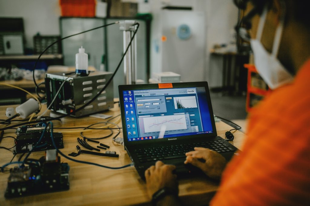 Photo of computer on engineering desk.