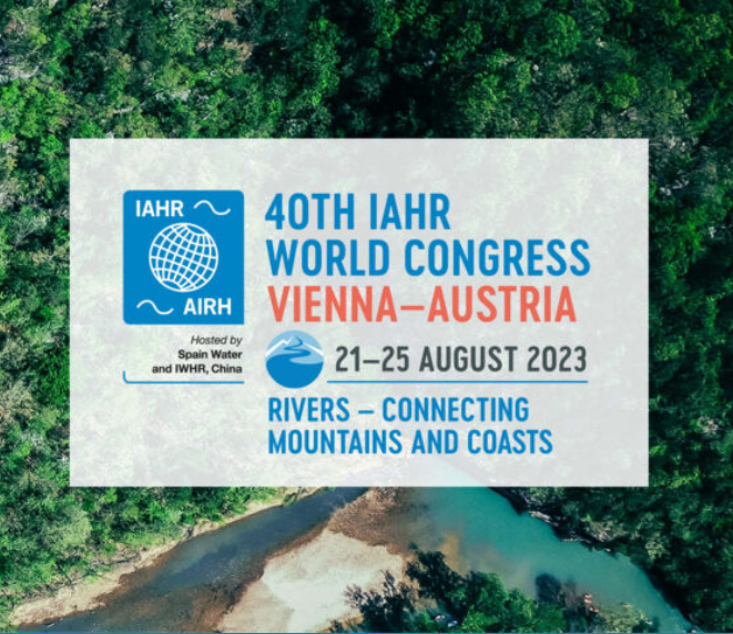 Aerial photo of river and forest with logo for 40th IAHR World Congress