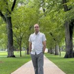 Pejman Fatehi standing on sidewalk in the Oval.