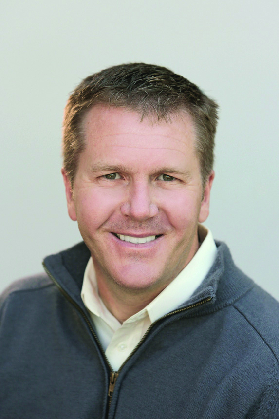 Portrait of Keith Meyer in blue shirt.