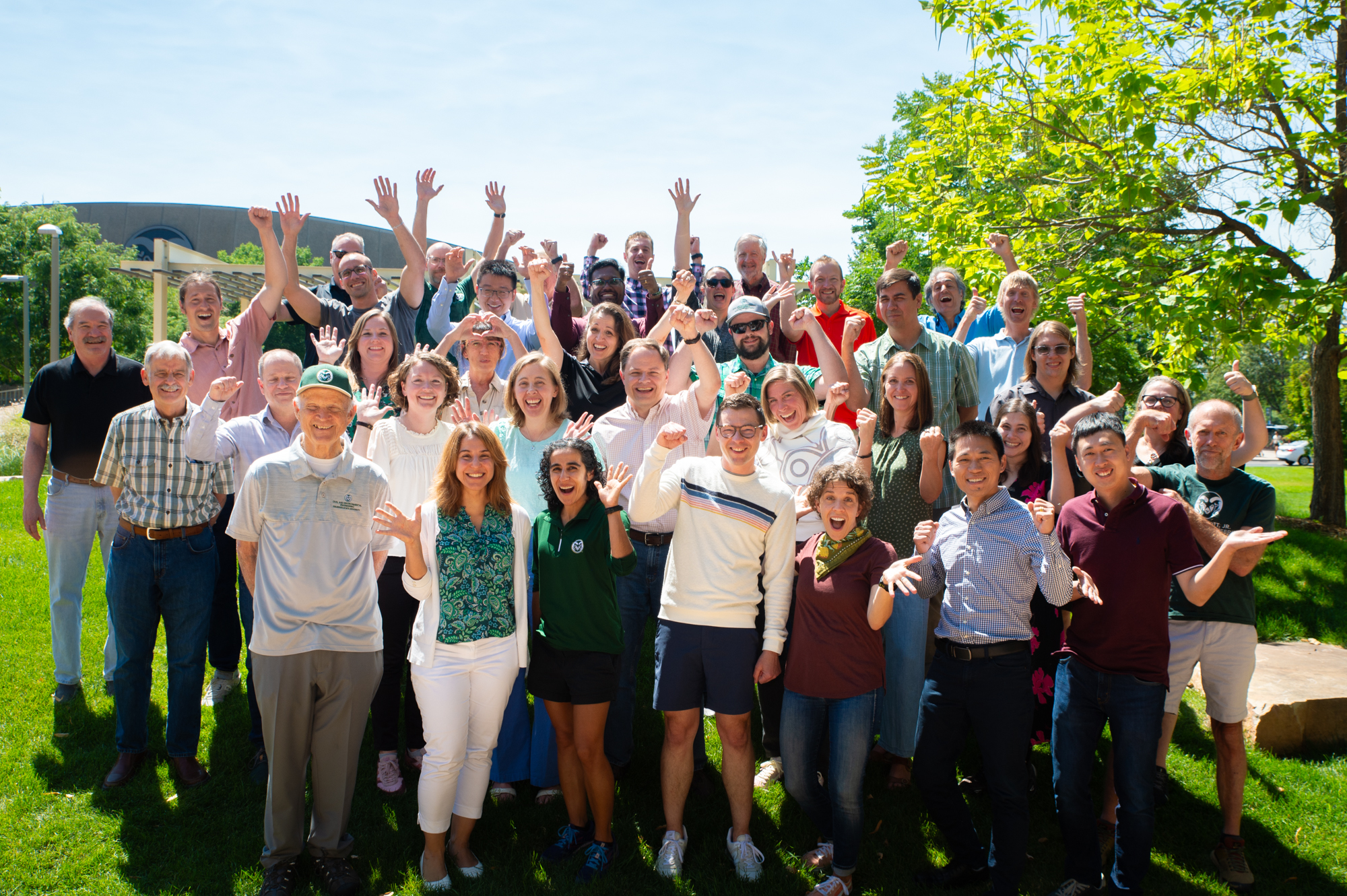 A group of people celebrating outside.