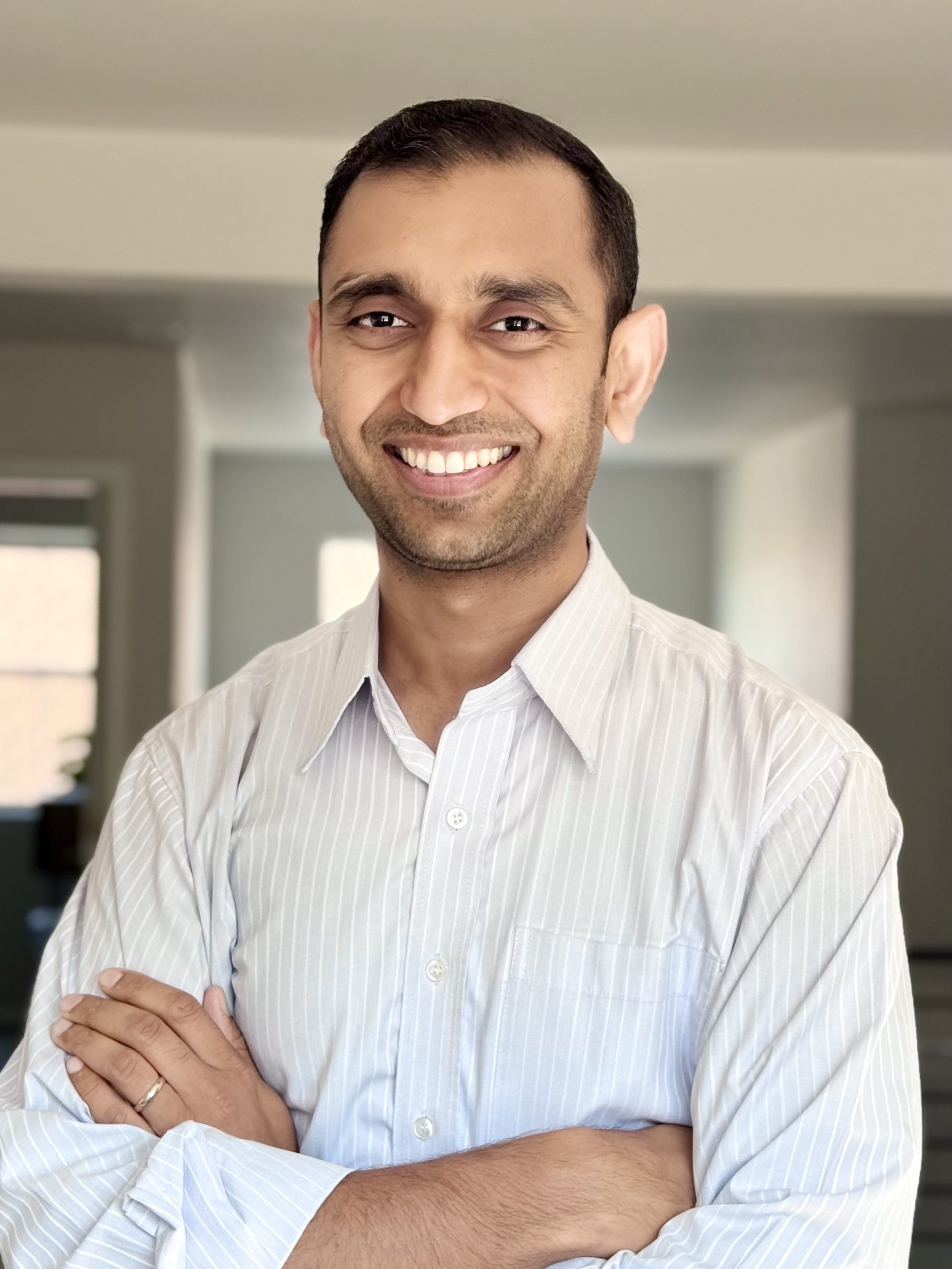 Portrait of Ashwin Dhanasekar in white shirt.
