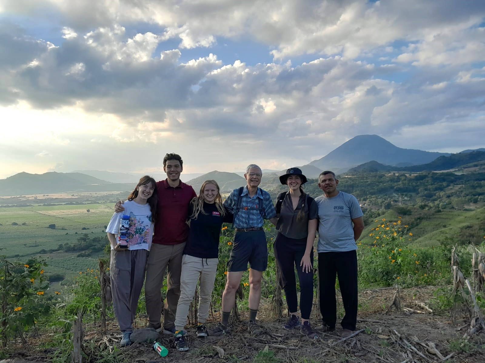 Students and faculty standing on a mountain in El Salvador