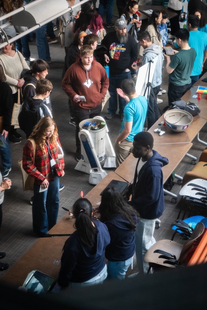 Crowd of people mingle at event at CSU