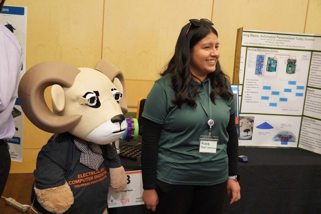 Woman stands next to ram
