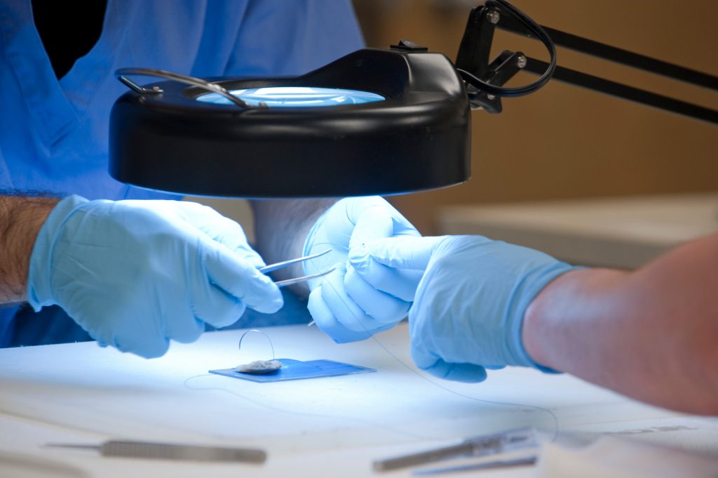 Ugur Ayturk working on specimen preparation for biomechanical testing of human annulus fibrosis tissue