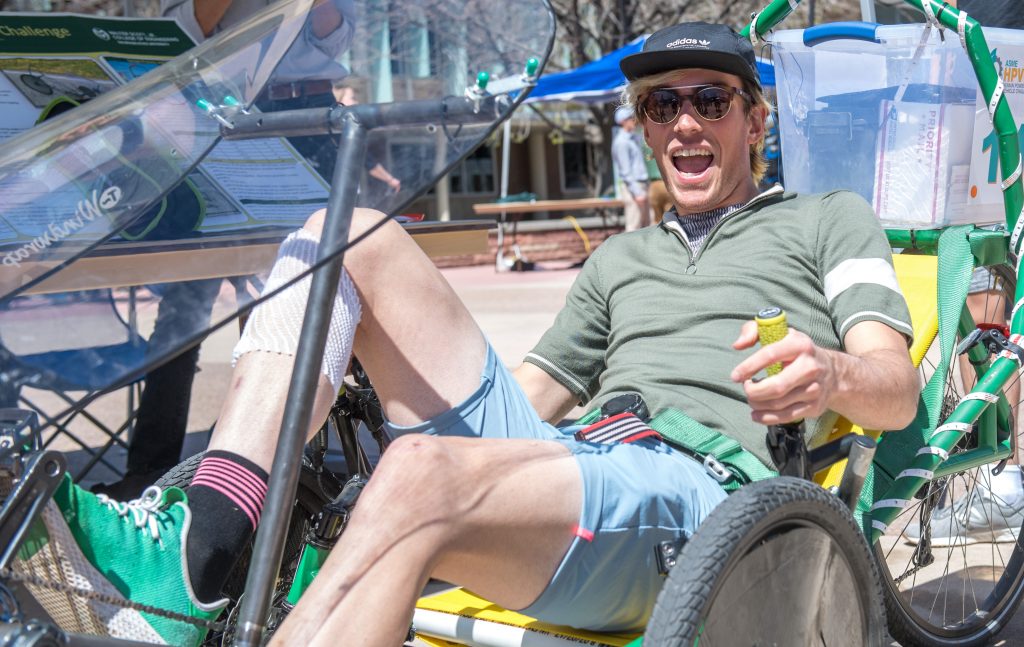 A man on a recumbent bike.