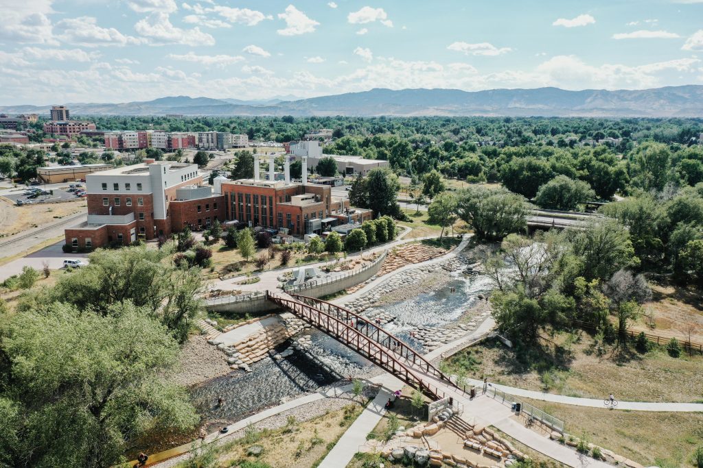 A bridge crosses a river taking students to the Powerhouse Energy Campus as Colorado State University