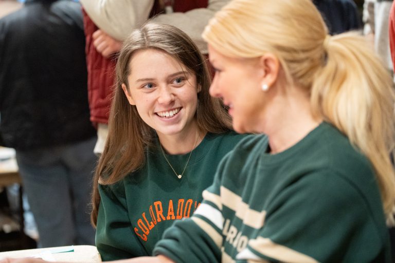 Student talking with adult