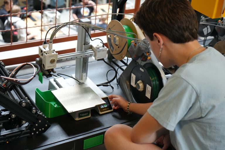 A student using a 3D printer