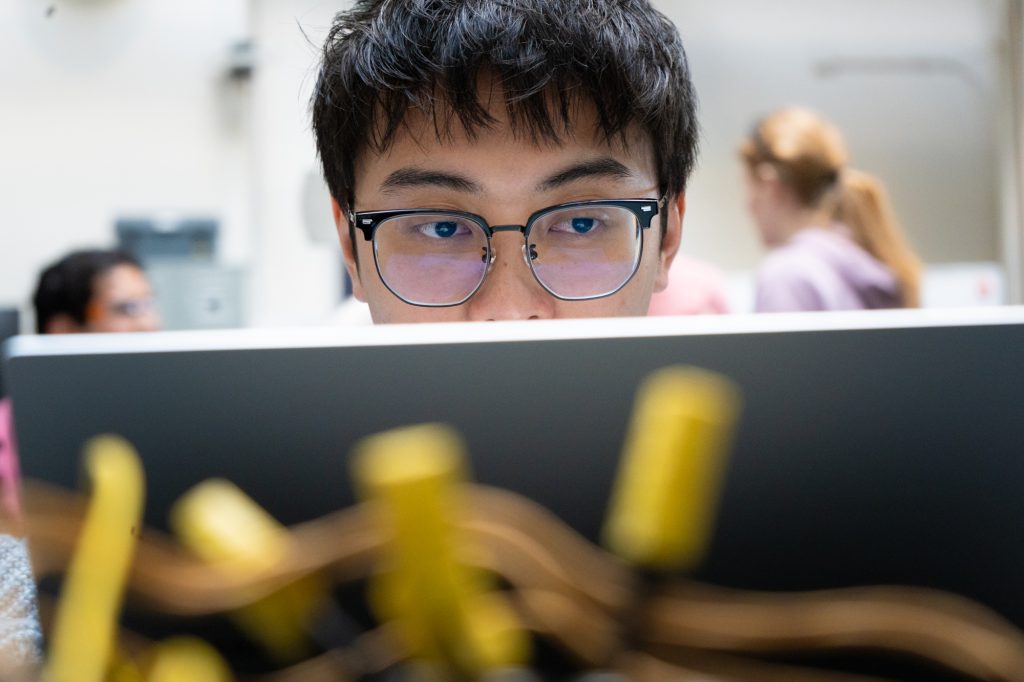 A student looks at a computer screen.