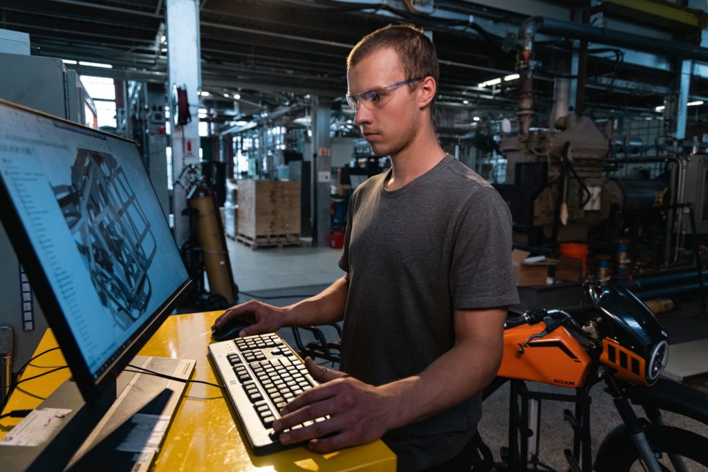 Mechanical engineering student, George Poggemeyer, works on an electric motorcycle in the Energy Institute Powerhouse. Shot on assignment for Find Your Energy Campaign. June 6, 2025.