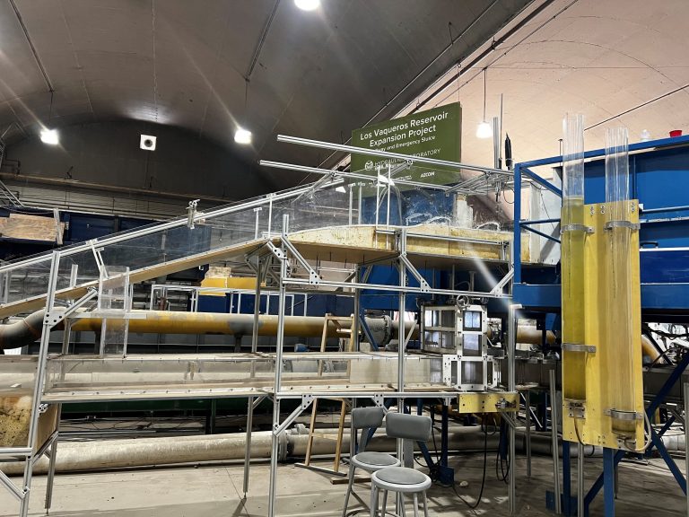 Scaffolding supporting an indoor hydraulic flume.