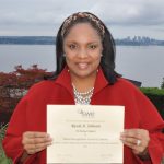 Ricole Johnson, a Colorado State University systems engineering Ph.D. student, holds her “Patent Recognition Award” from the Society of Women Engineers.
