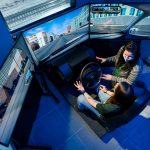 Erika Gallegos, Assistant Professor in the Systems Engineering department in the Walter Scott, Jr. College of Engineering works with test student on drive simulator, December 17, 2020.