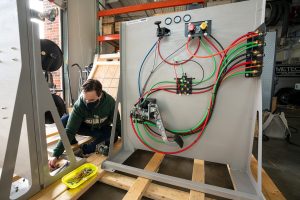 Jeremy Daily, Assistant/Associate Professor-Cyber Security in the department of Systems Engineering in the Walter Scott, Jr. College of Engineering works with graduate students in putting together test platforms for his research at Colorado State University's Powerhouse, December 17, 2020.