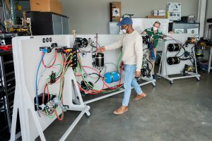 Jeremy Daily, Assistant/Associate Professor-Cyber Security in the department of Systems Engineering in the Walter Scott, Jr. College of Engineering works with graduate students in putting together test platforms for his research at Colorado State University's Powerhouse, December 17, 2020.