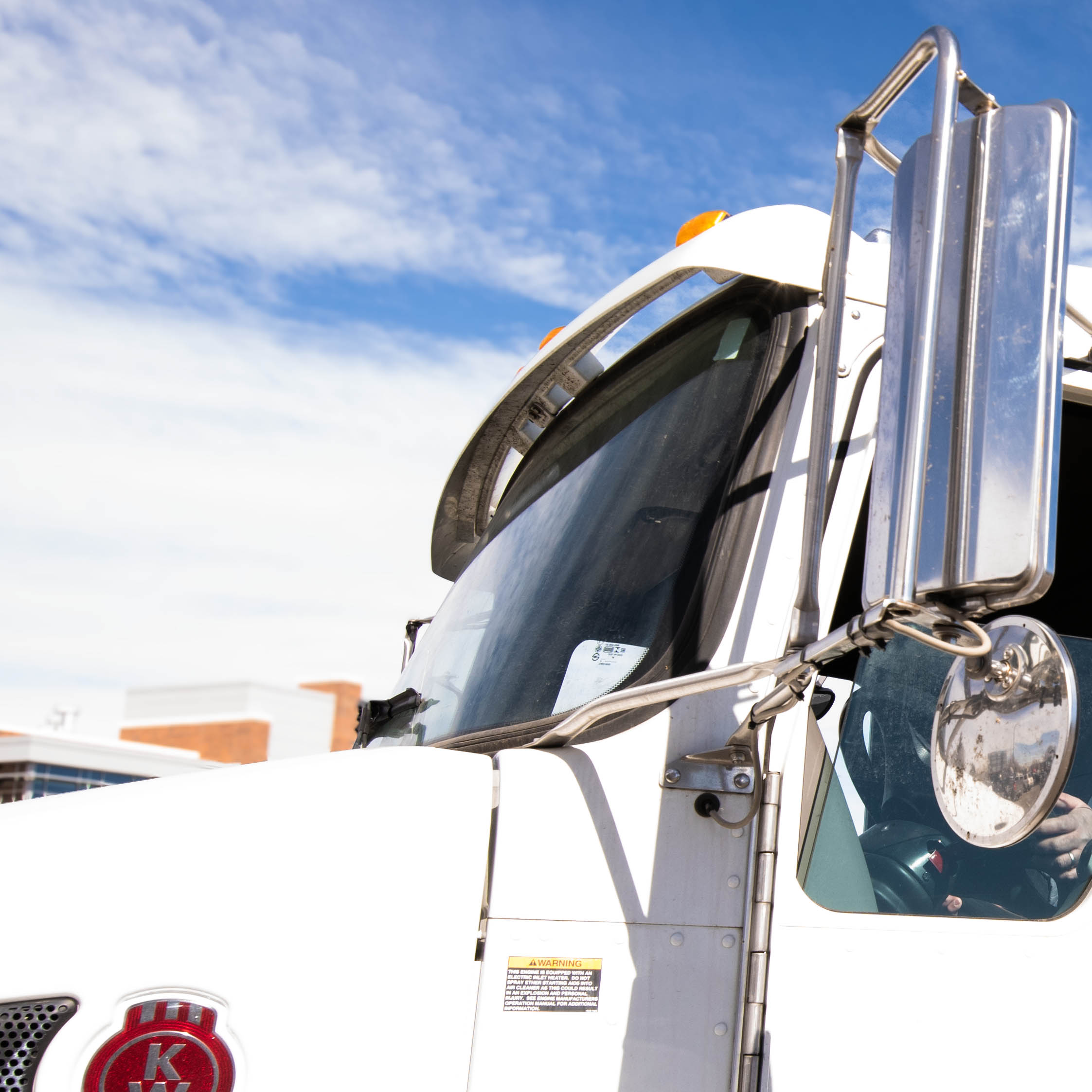 Image of a large truck's front window.