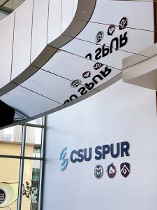 Foyer area with "CSU SPUR" spelled out on the wall. 