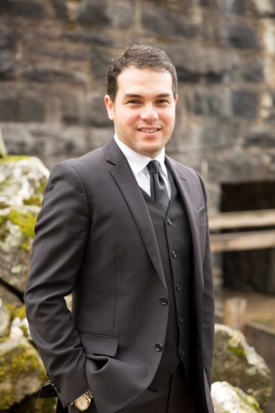 Image of a young man in a suit.