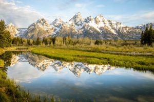 A beautiful mountain range is reflected in a lake. 