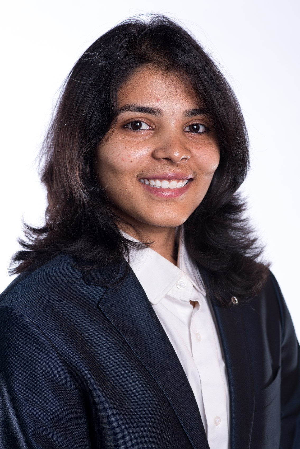 A woman in a suit jacket.