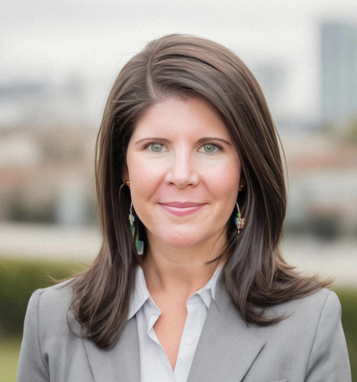 A woman in formal business clothing.