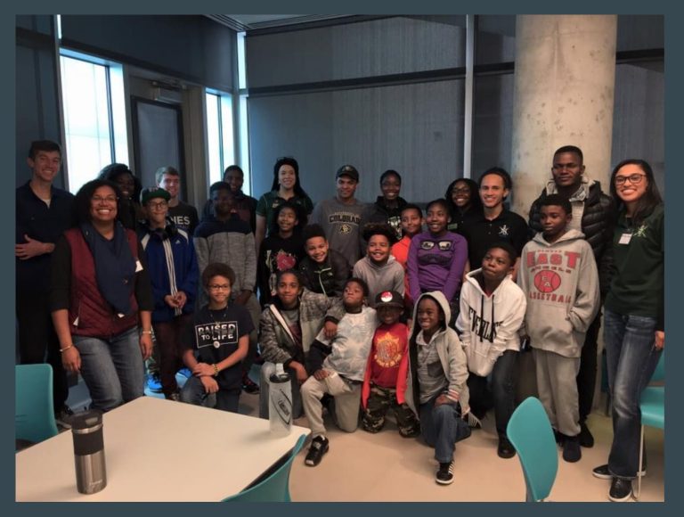 College and elementary students pose during a 2017 NSBE event.