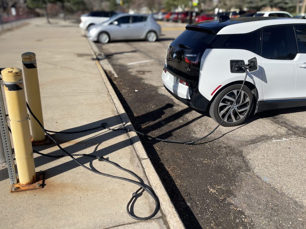 An electric car is connected to a recharging station on Colorado State University's campus.