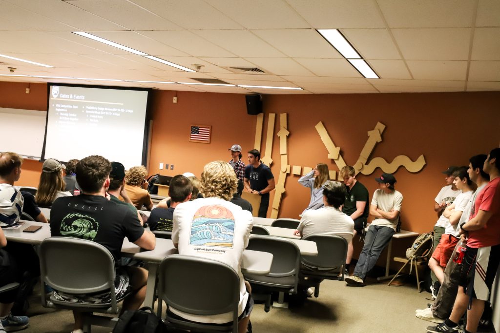 Engineering students give a presentation to a class of their peers.