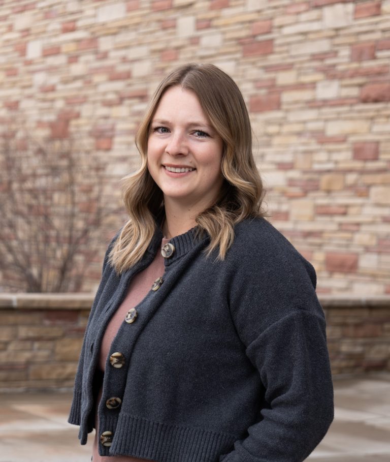 Casual outdoor portrait of Kayla Cothrun on the west approach to the Scott Bioengineering Building at CSU.