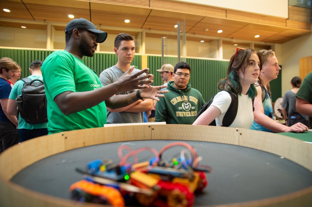Students look at a project at the Fall 2025 student engagement fair.